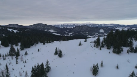 Snowy landscape in a mountain range.