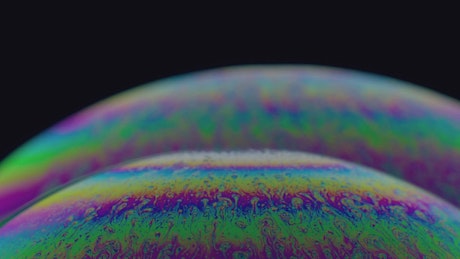 Soap bubbles with an abstract and colorful iridescent effect.