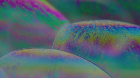 Soap bubbles with litmus effect in close view.