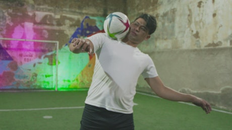 Soccer freestyler doing skillful tricks with the ball