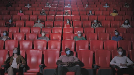 Social distancing crowd in a cinema.