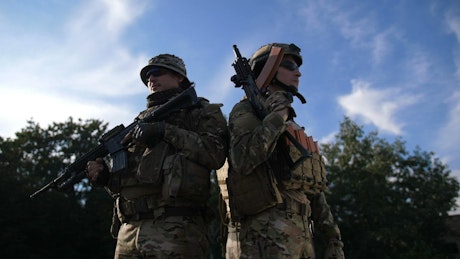 Soldiers standing with rifles