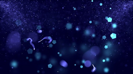 Sparkling particles on blue background