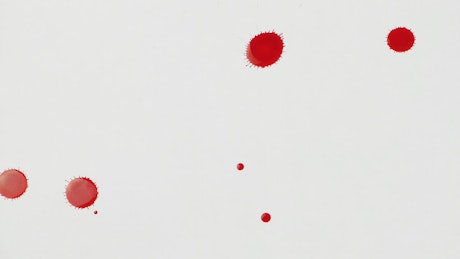 Splashing blood on white surface