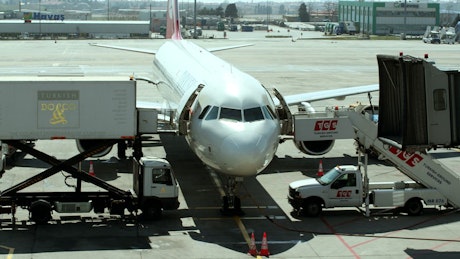 Staff preparing passenger plane for take-off.