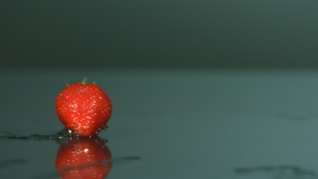 Strawberrie bouncing in slow motion.