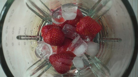 Strawberries and ice in the blender