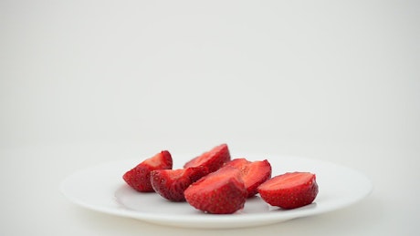 Strawberries in a plate on white background