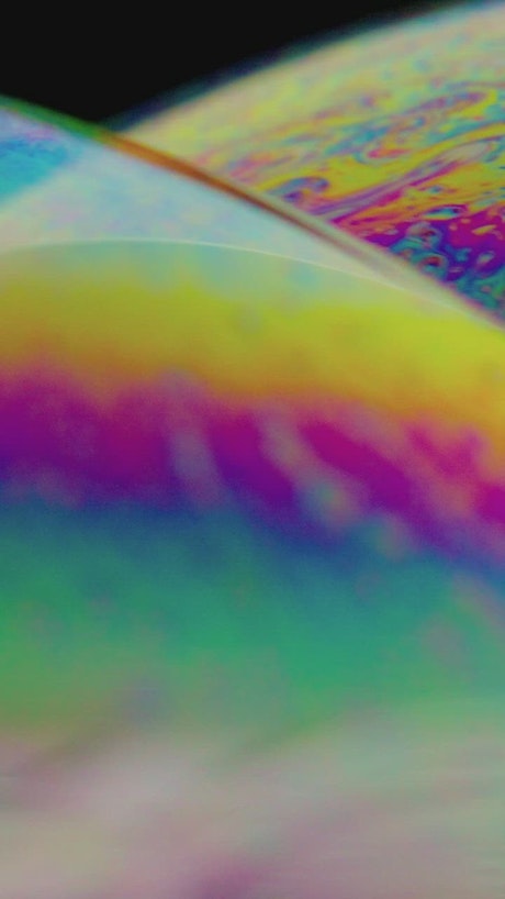 Striking shapes and colors on the surface of a soap bubble.