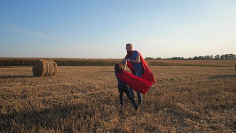 Superheros playing in a field