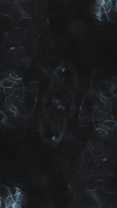 Swirling smoke with black background.