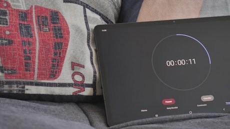 Tablet on a sofa running a timer.