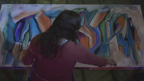 Talented artist painting an abstract picture.