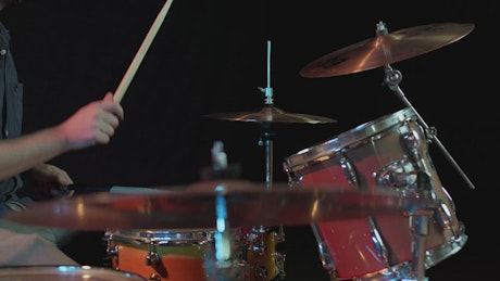 Talented drummer playing in a close shot.