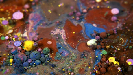 Texture and shapes of colored paints under water