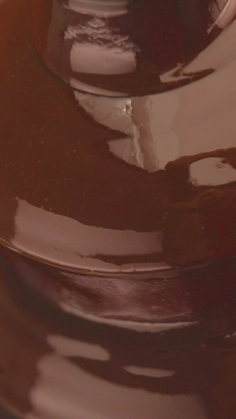 Texture of a liquid chocolate fountain.
