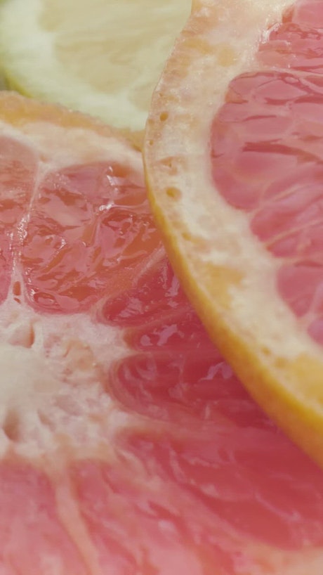 Texture of fresh grapefruit slices.
