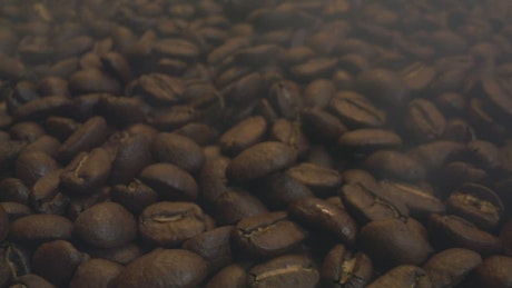 Texture of hot and steaming coffee beans.