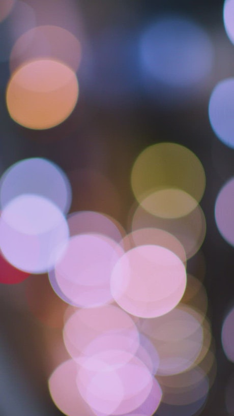 Texture of many colored lights in a defocused shot.