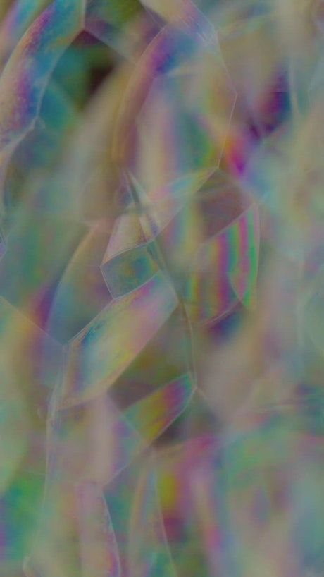 Texture of many soap bubbles with iridescent colors.