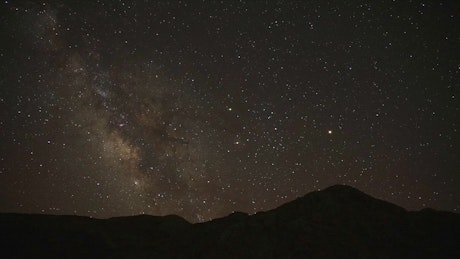 The milky way is moving in the night sky.