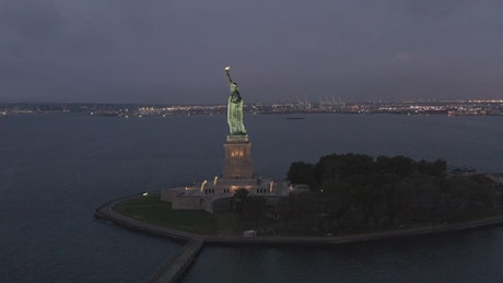 The statue of liberty at night.
