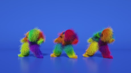 三个有趣的五颜六色的男人随着欢快的音乐跳舞