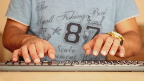 Time-lapse of a person typing on a keyboard
