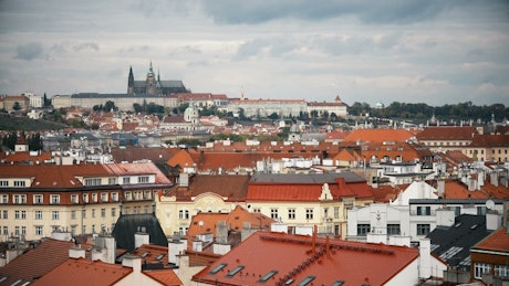 Timelapse aerial view of the old architecture in Prague on a cloudy da.