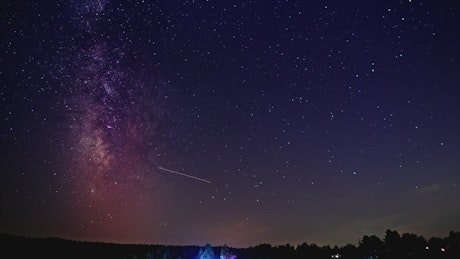 Timelapse of a nightsky with shooting stars.