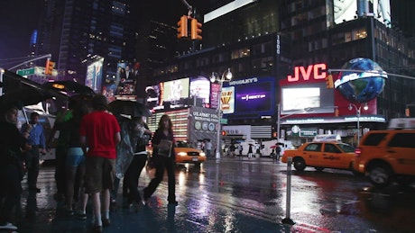 Times Square during a rainy night.