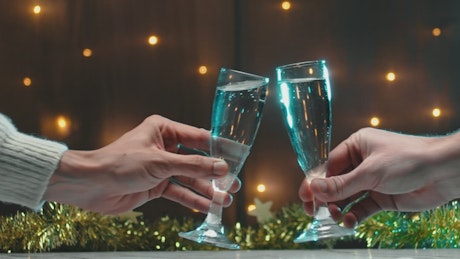 Toast with two glasses of champagne on new year's eve.