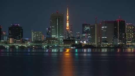 Tokyo urban cityscape with a tower at night.