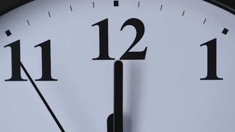 Top of a wall clock in a close-up shot