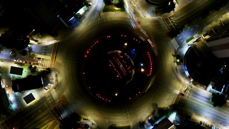 Top view of the traffic around a roundabout at night.