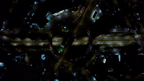 Top view of the traffic around going a roundabout at night.