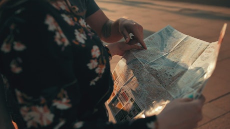 Tourist couple looking at a city map.