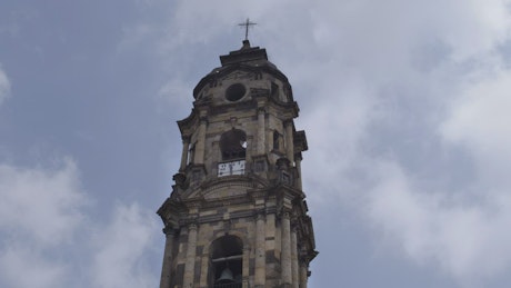 Tower of a church with a clock on a sunny day