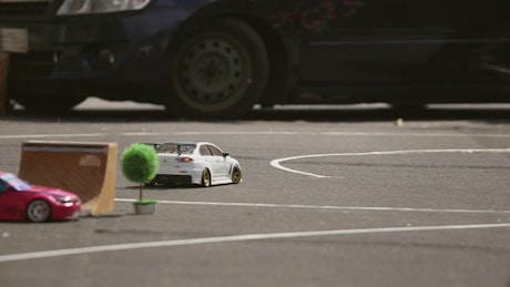 Toy car drifting around a race track.