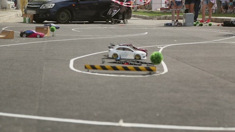 Toy car racing and drifting around a race track.