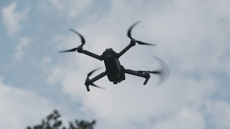 Tracking shot of a drone flying through the air