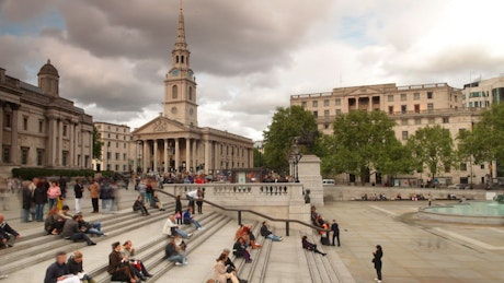 Trafalgar Square in London on a cloudy afternoon.