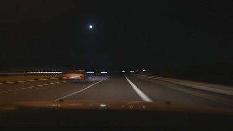 Traveling in the night by car.