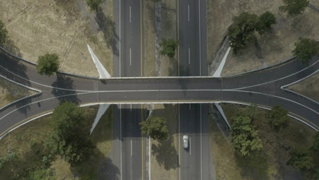 Turnaround bridge on a highway in a shot from above.