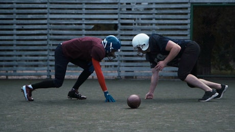Two American football players in practice.