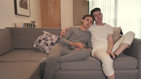 Two boyfriends watch TV