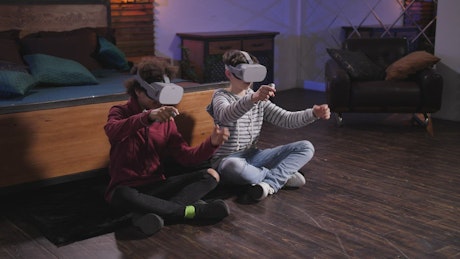 Two boys playing a VR game.