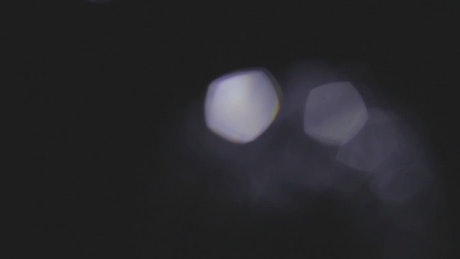 Unfocused lights in a black background