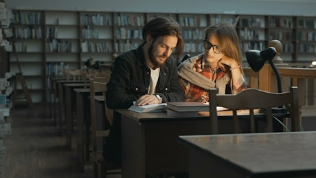 University students studying late in the library
