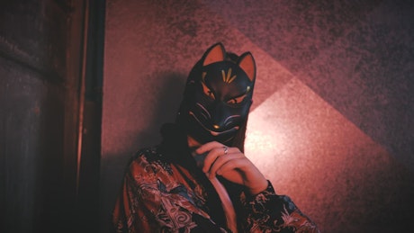 Urban trendy woman wearing a cat mask.